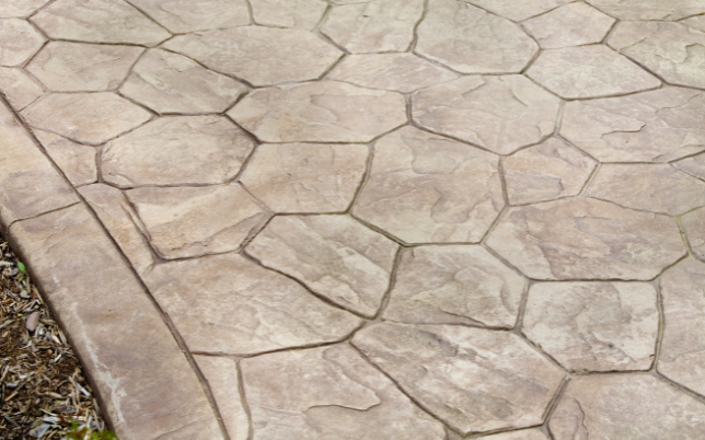 Sophisticated stamped concrete walkway in Cincinnati, OH, displaying a natural pattern.