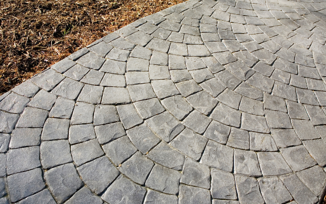 Artistic and durable stamped concrete patio design in Cincinnati, blending functionality and aesthetics.
