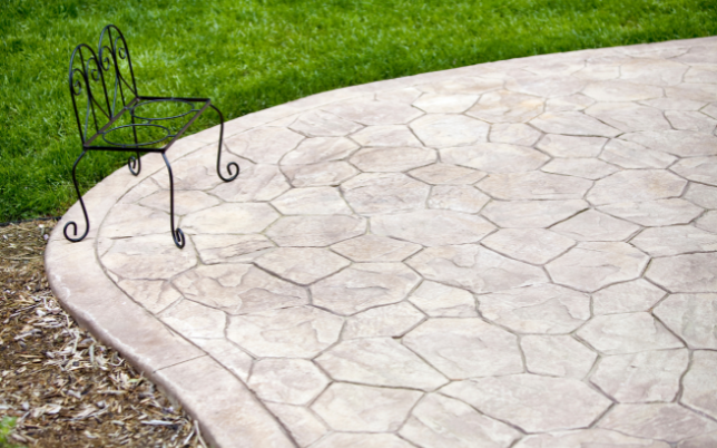 Rustic stamped concrete patio in Cincinnati, OH, with a wood plank effect for a natural look.