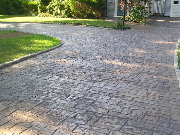 Intricate brick-patterned stamped concrete driveway in Cincinnati, OH.
